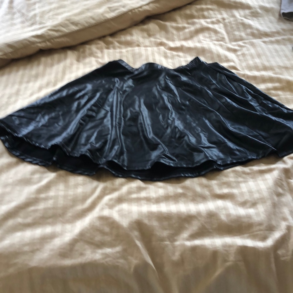 Black faux leather mini skirt.